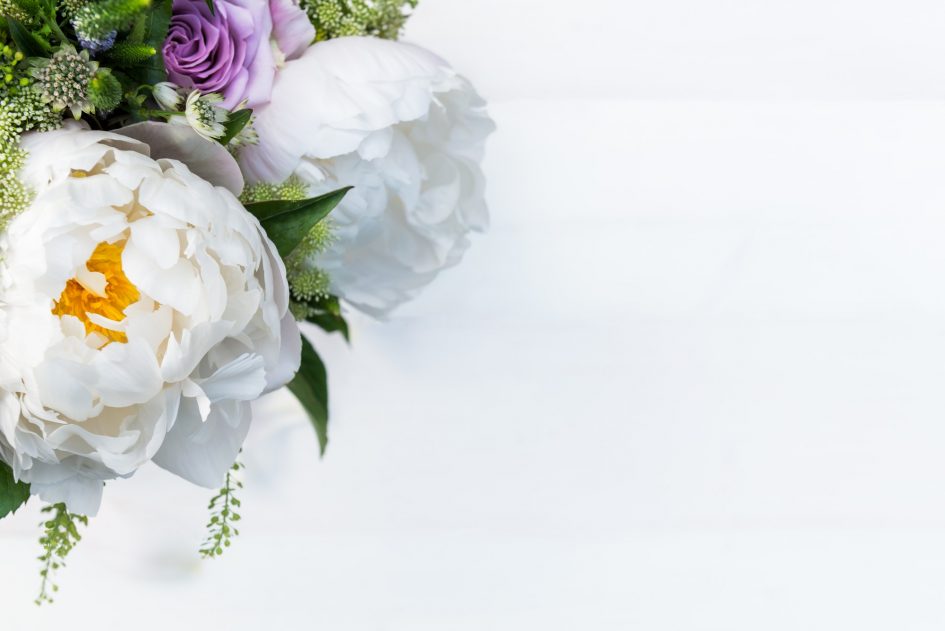 Bouquet of flowers from big peonies and pastel roses