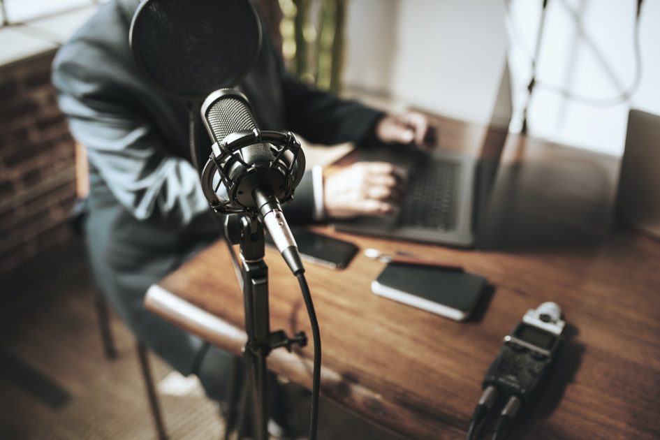 man recording a podcast