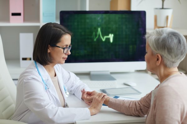 Doctor Checking Heart Rate of Senior Patient