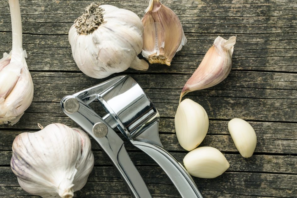 Garlic and garlic press.