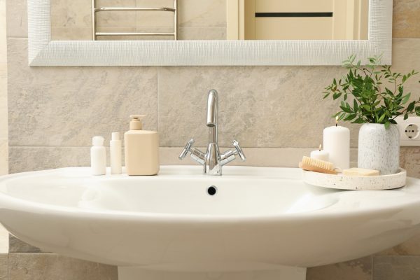 Sink and personal hygiene accessories in bathroom