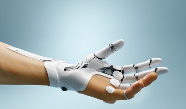 Robotic bionic hand connected with human hand.
