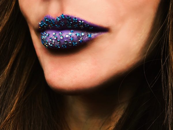 Lips with blue lipstick and blue glitter