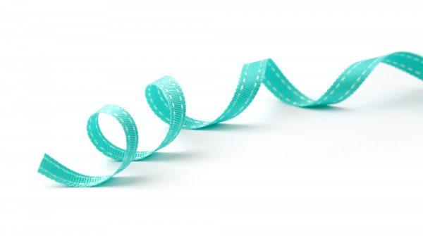 Blue (turquoise) silk ribbon with on white background.