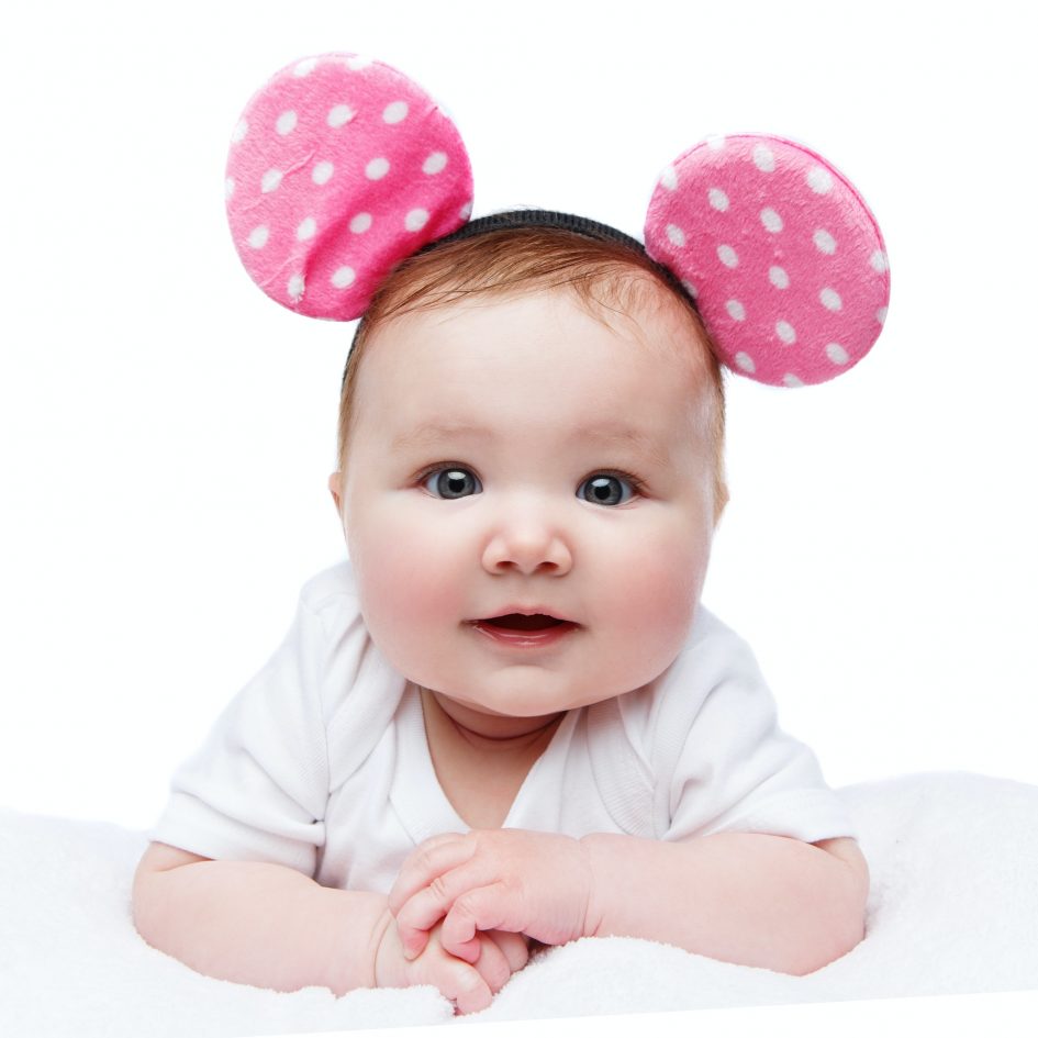 funny little baby girl in mouse ears headband