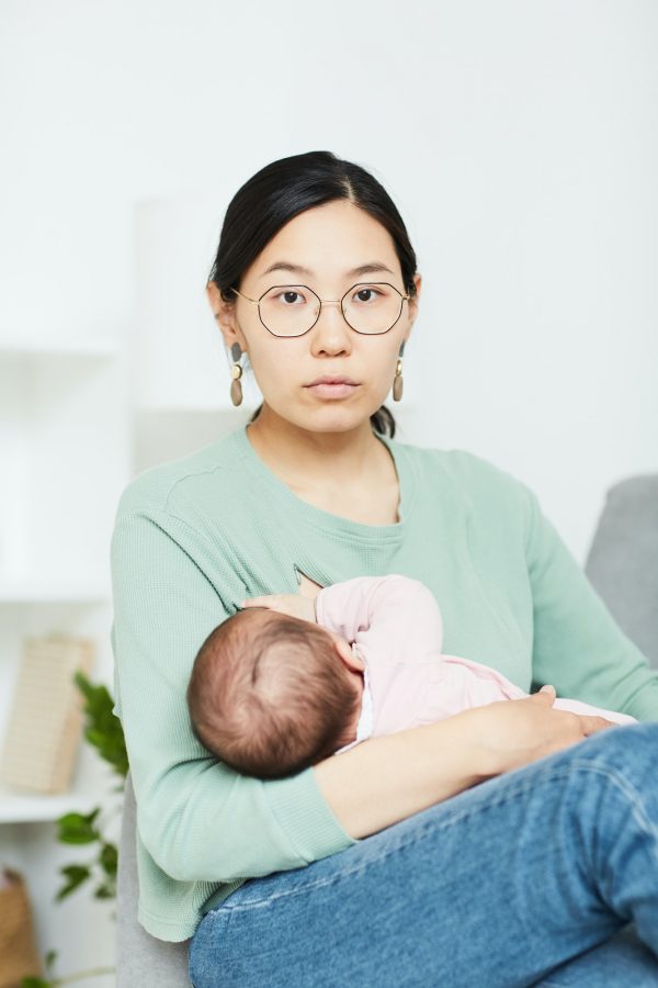 Woman with baby at home